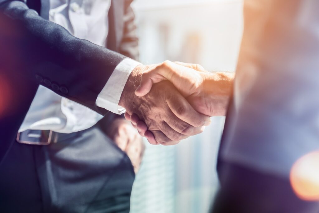 Businessman handshake for teamwork of business merger and acquisition,successful negotiate,hand shake,two businessman shake hand with partner to celebration partnership and business deal concept